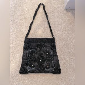 Black beaded soft medium sized clutch or hand bag
